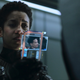 Naomi (Dominique Tipper) looks at an image of her son for the first time in years.